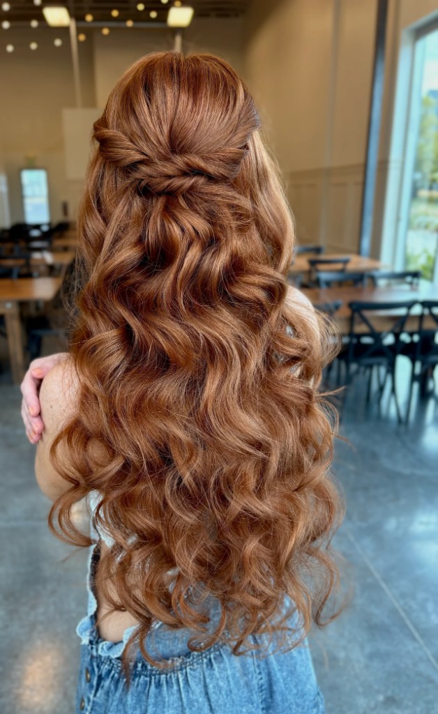 Half up half down bridal hairstyle with long-lasting waves by an Orlando, Florida wedding hairstylist